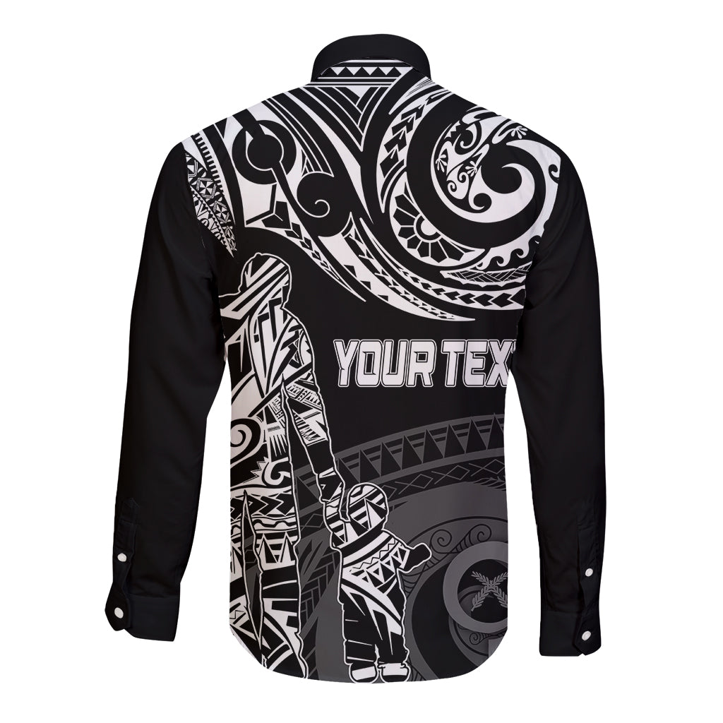 Black long-sleeve button shirt with white Polynesian back graphic and bold text