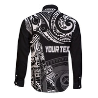 Black long-sleeve button shirt with white Polynesian back graphic and bold text