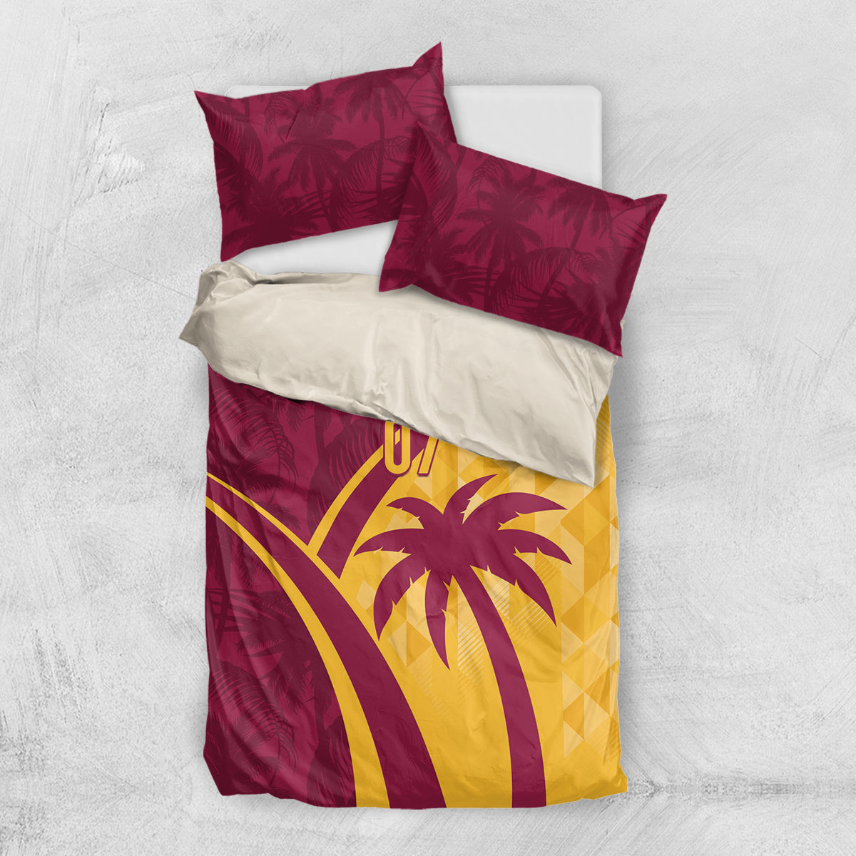 Maroon and yellow tropical bedding set with palm and “07” graphic, two pillows