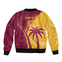 Maroon and yellow tropical bomber jacket back print with palm tree, '07' text, and black ribbed hem