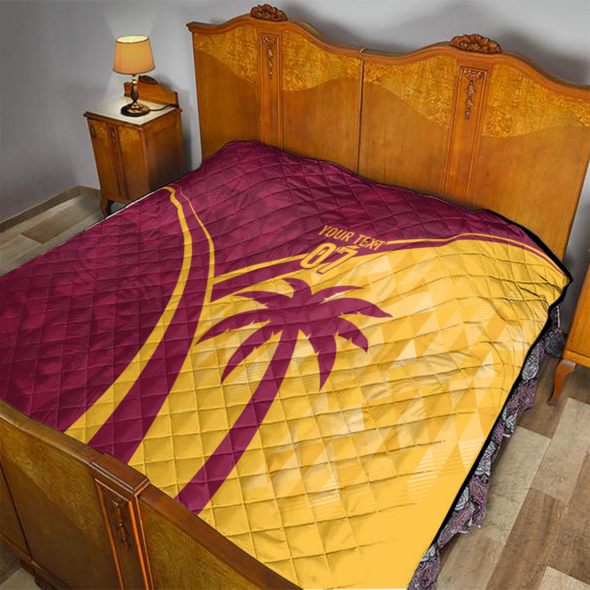 Maroon and yellow quilt with diamond quilting, cricket emblem and custom text on bed