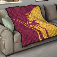 Maroon and yellow quilt with diamond stitching, cricket emblem and custom text on sofa