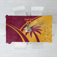 Maroon and yellow tropical cricket tablecloth with palm-leaf and geometric design.