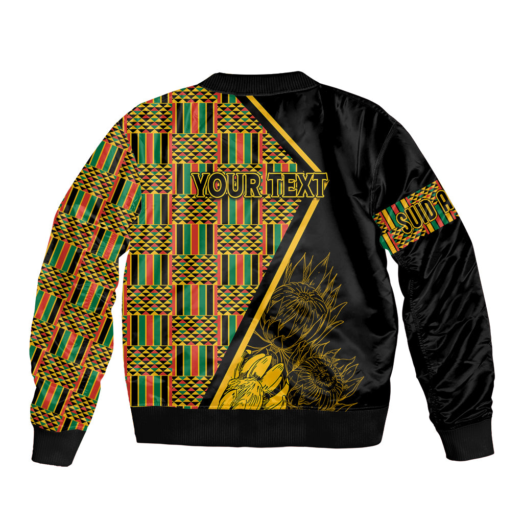 Black bomber jacket back with multicolor kente pattern panels and gold flower graphic