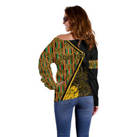 Off-shoulder sweater with diagonal kente grid and back printed text, black long sleeves