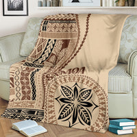 Beige siapo motif blanket with brown vertical panel, flower-leaf emblem, and border motifs
