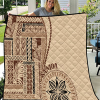 Samoa siapo motif quilt in beige with brown geometric blocks and leaf emblem detail