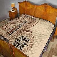 Samoa siapo motif quilt with beige base and brown geometric bands on bed