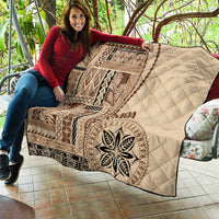 Samoa siapo motif quilt held outdoors, beige quilted fabric with brown geometric design
