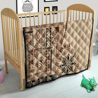 Samoa siapo motif quilt on a wooden crib, beige with brown geometric pattern and leaf circle