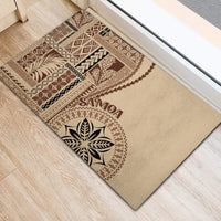Beige rubber doormat featuring brown Samoa-inspired border and leaf medallion