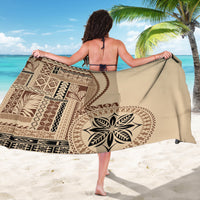Beige Samoa siapo motif sarong draped back view with circular leaf medallion