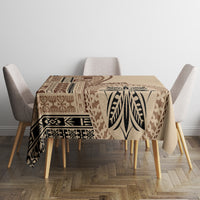 Beige tablecloth with brown leaf and geometric panel design, covering square dining table