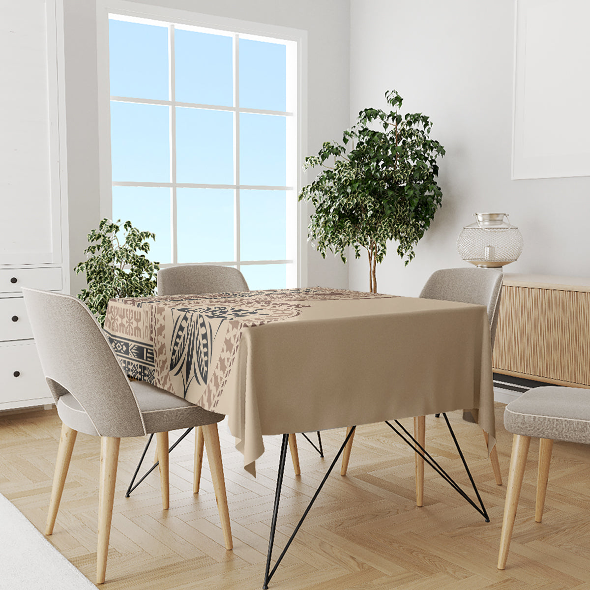 Beige tablecloth with dark brown geometric border and leaf motif, on dining table with chairs