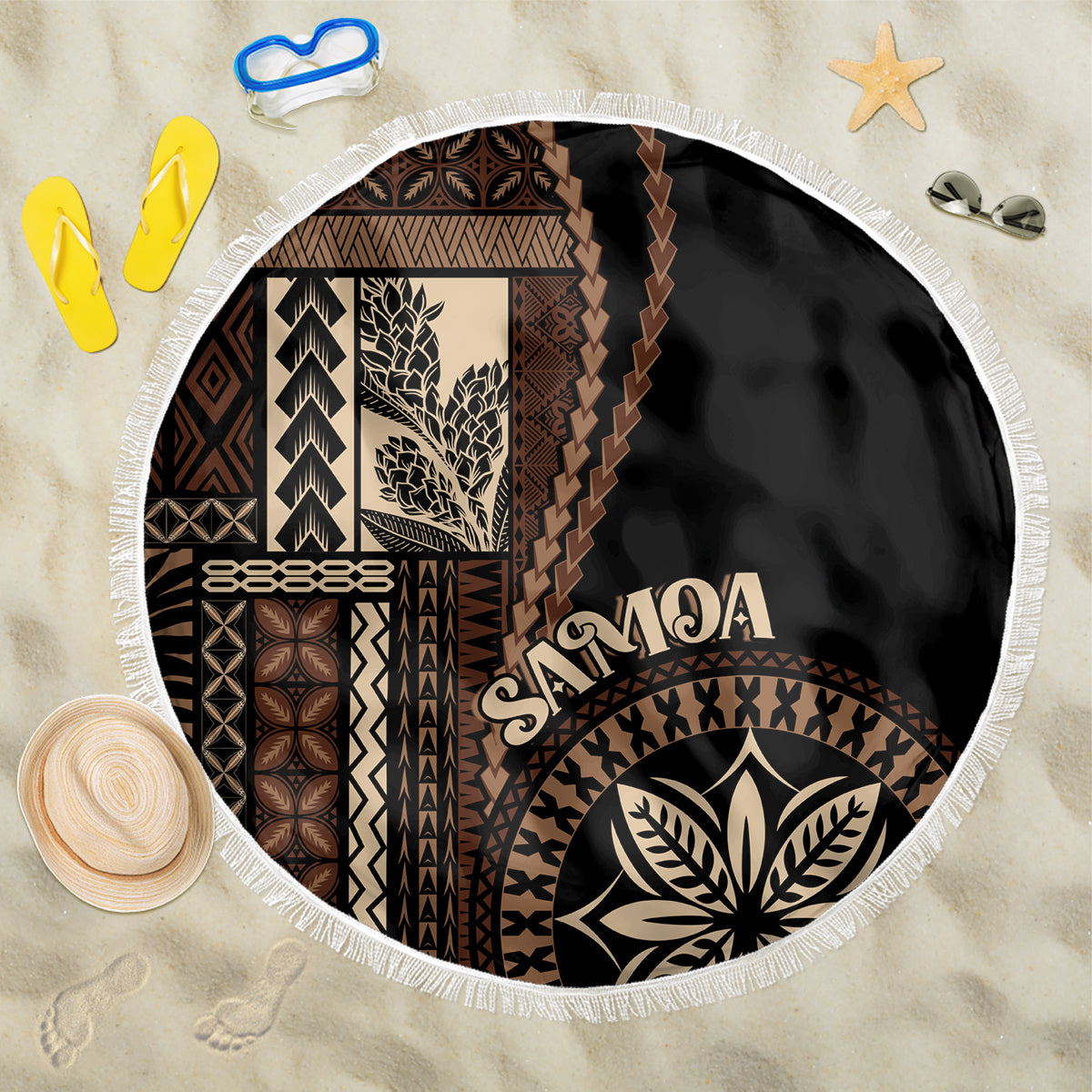 Black round beach blanket with tassel fringe and Samoan tapa-style motifs inside