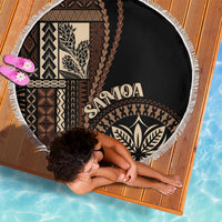 Black round beach blanket with white fringe, tapa panels and SAMOA lettering