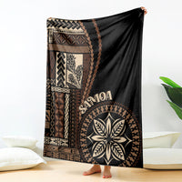 Samoa siapo motif blanket in black with geometric panels and large leaf emblem