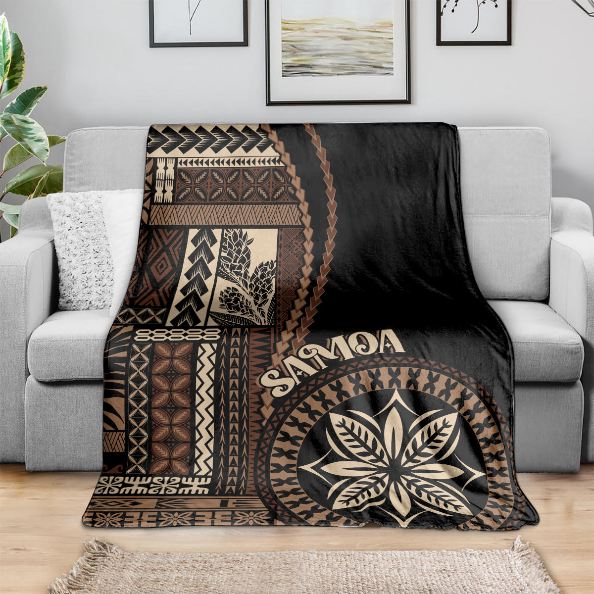 Black Samoa siapo motif blanket draped over couch with geometric border and leaf medallion