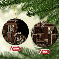 Round ceramic ornament with Samoa motif, black and tan pattern, gold hanging loop; FRONT/BACK tags