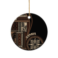 Round black ceramic ornament with Samoa motif and tan pattern, gold hanging loop