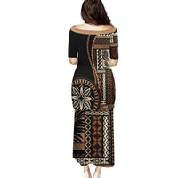 Black long dress with short sleeves and large geometric siapo motif panel