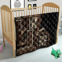 Black Samoa siapo motif quilt blanket for crib with tan geometric panels and leaf emblem