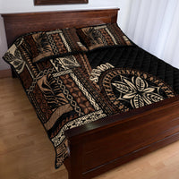 Black siapo motif quilt bed set with geometric patchwork panels and leaf emblem detail