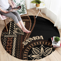 Black round siapo motif rug with brown geometric bands, 'Samoa' text, and leaf emblem