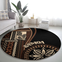 Black round siapo motif rug with 'Samoa' lettering and large leaf-and-feather emblem