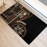 Black doormat featuring circular leaf emblem, Samoa text, and woven siapo motifs in tan