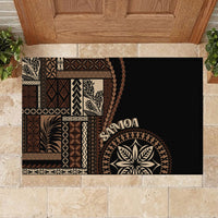 Black rectangular doormat with Samoa text, leaf medallion, and traditional siapo artwork