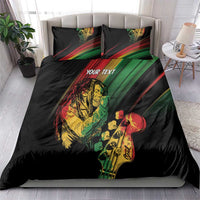 Personalised reggae bedding set on bed: black duvet with colorful reggae musician print, 'YOUR TEXT'