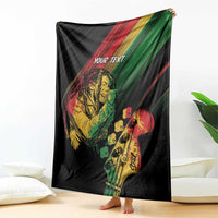 Personalized reggae blanket draped, black with musician graphic and green/red stripes
