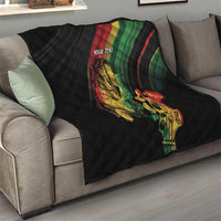 Personalized reggae quilt on sofa, black quilt with reggae musician artwork and 'YOUR TEXT'.