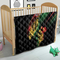 Personalized reggae quilt on baby bed, black quilt with musician print and 'YOUR TEXT'.
