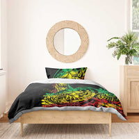 Black duvet cover with green, yellow, red Polynesian reggae design and matching pillow
