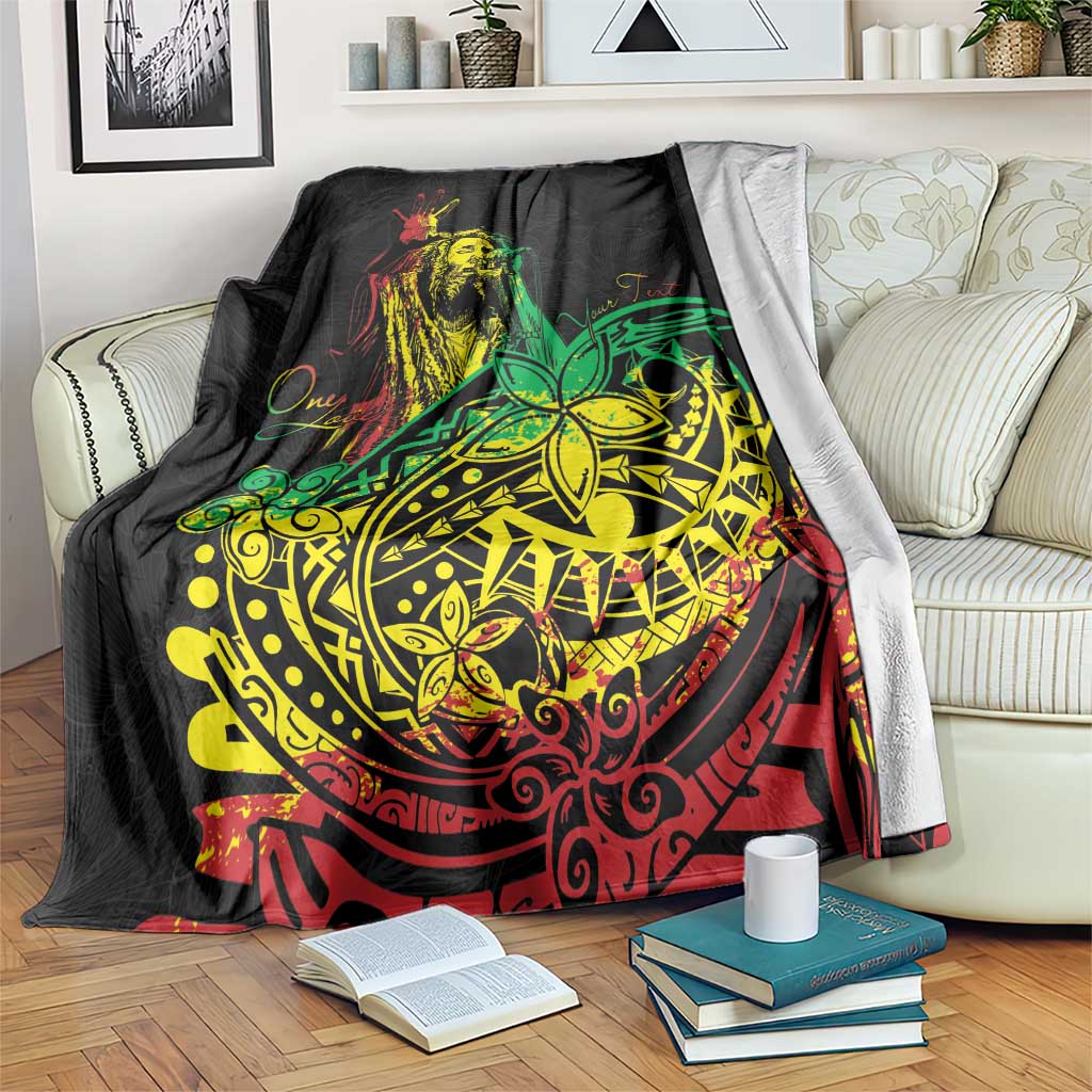 Black blanket with colorful reggae dancer and tribal circular graphic, draped on couch