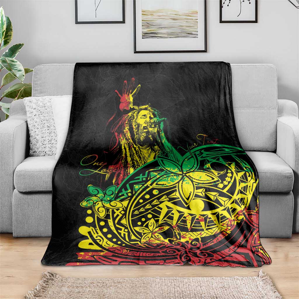 Black blanket featuring reggae dancer artwork and green-yellow tribal emblem on couch