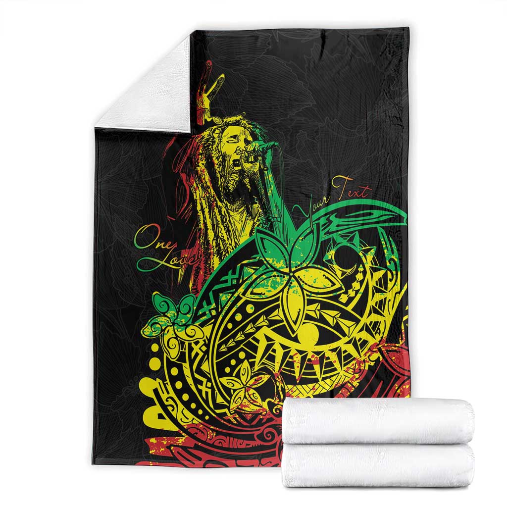 Black blanket with reggae dancer graphic, folded and paired with white towels