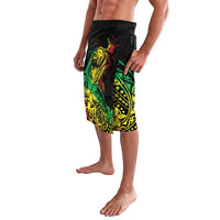 Men's black board shorts featuring bright green, yellow and red tropical characters