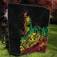 Black diamond-quilted blanket with reggae dancer artwork and green, yellow, red decorative details.