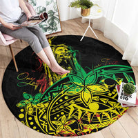 Round area rug, black with neon green/yellow/red Polynesian style graphic, wide view