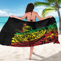 Black sarong with bold green, yellow, and red Polynesian-style print
