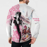 Back button sweatshirt with roses, horses, and bridge graphic; pink checkered sleeve patch.