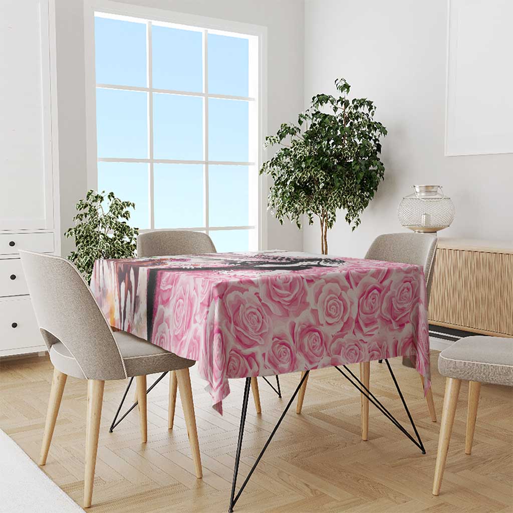 Pink rose-pattern tablecloth with draped corners on dining table