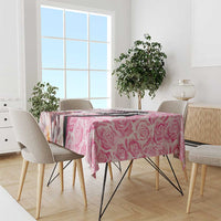 Pink rose-pattern tablecloth with draped corners on dining table