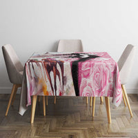 Pink rose-pattern tablecloth on square table with four chairs