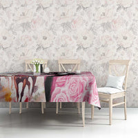 Pink rose-pattern tablecloth on dining table with matching chairs