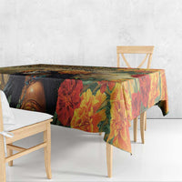 Rectangular tablecloth with large red flowers, multicolor leaves, and dark illustrated face