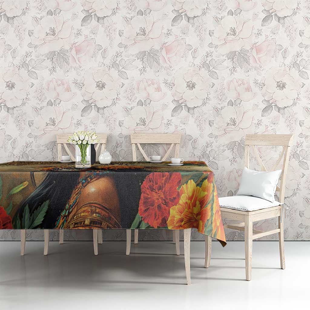 Rectangular tablecloth with red and yellow blossoms and a dark portrait panel